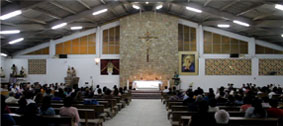 The Parish of Santisimo Sacramento is always bustling. A steady stream of parishioners can be seen kneeling in pray most every hour of the day. Bottom, is a motor taxi, one of the more common forms of transportation.